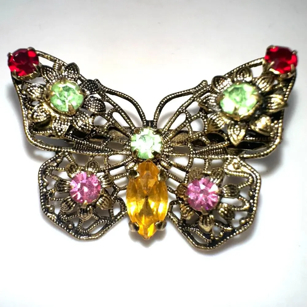 Vintage gold tone filigree multicolor prong set rhinestones butterfly brooch